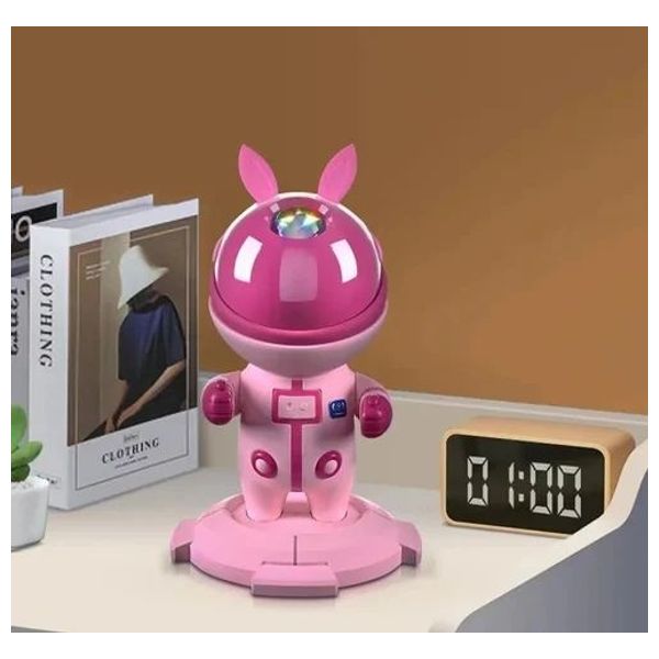  جهاز عرض النجوم اري غيمينغ - بتصميم رائد فضاء - يعرض نجوم وسحب السديم - إضاءة قابلة للدوران 360° - يعمل بـ يو اس بي - وردي 